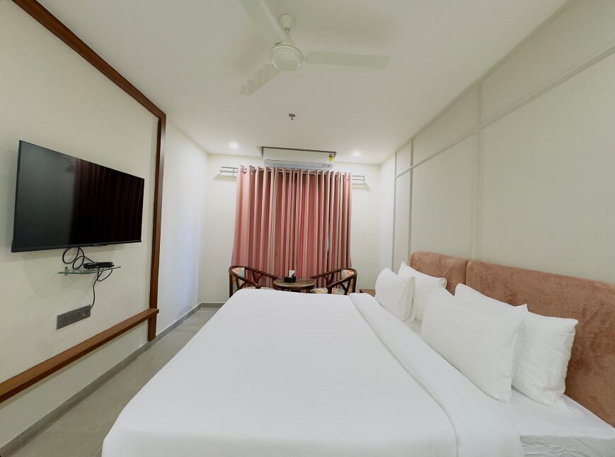 Executive Room bed and amenities at Nirvana Boutique Hotel Ujjain