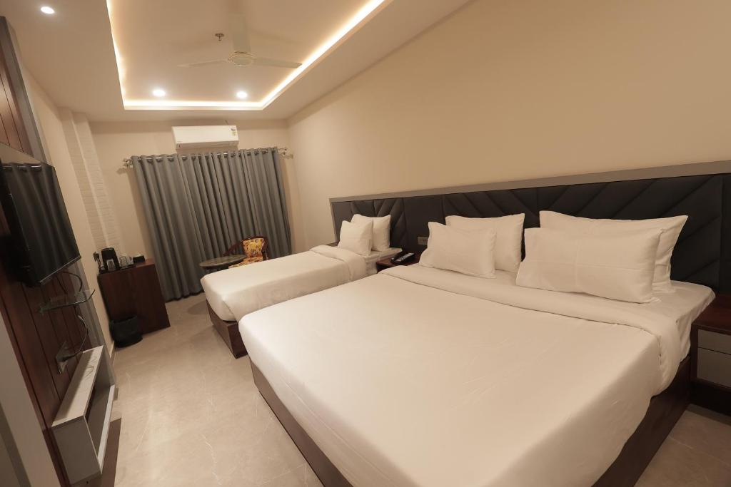 Superior Triple Room modern amenities at Nirvana Boutique Hotel Ujjain
